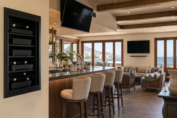 Soundbar and decoder connected over HDMI-ARC behind a wall-mounted screen